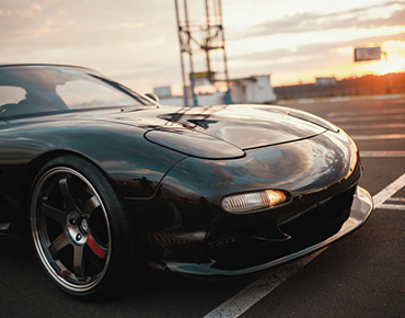 classic Japanese sports car on sunset