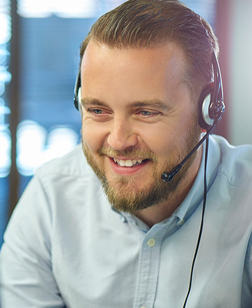 happy young man working in a call centre